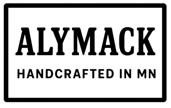 Logo with 'ALYMACK HANDCRAFTED IN MN' text on a white background